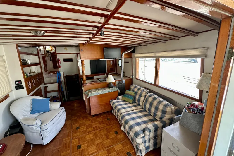 Slide: The Image of 1983 Kadey-Krogen Krogen 42 Trawler interior with cozy seating and wooden accents. - 30