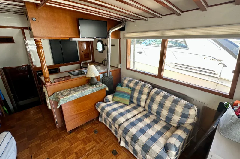 Slide: The Image of Interior of 1983 Kadey-Krogen Krogen 42 Trawler with cozy seating and kitchenette. - 31