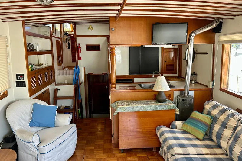 Slide: The Image of Interior of 1983 Kadey-Krogen Krogen 42 Trawler with cozy seating and wooden finishes. - 33