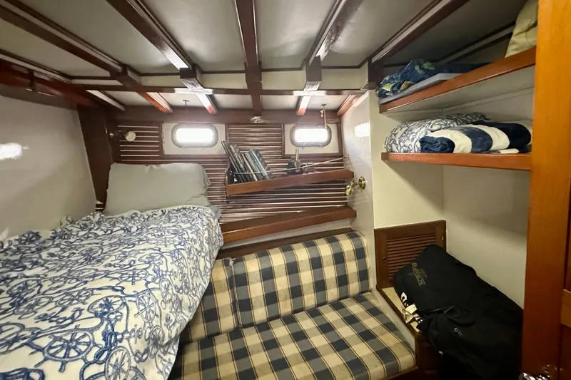 Slide: The Image of Cozy cabin interior of 1983 Kadey-Krogen Krogen 42 Trawler with bunk beds and storage. - 35