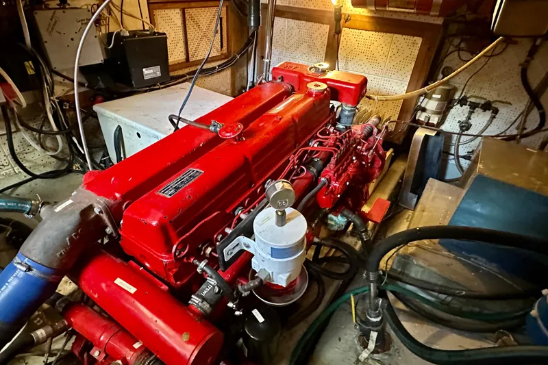 Slide: The Image of Engine room of a 1983 Kadey-Krogen Krogen 42 Trawler with a red engine. - 38