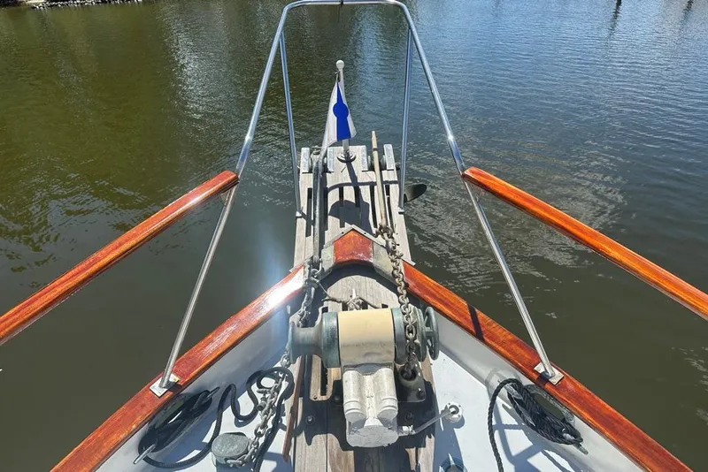 Slide: The Image of Bow view of 1983 Kadey-Krogen Krogen 42 Trawler on calm water. - 6