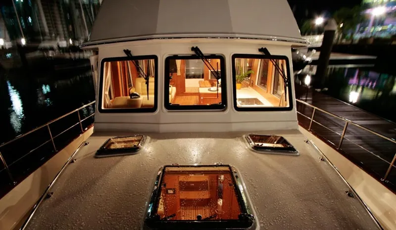 Slide: The Image of 2015 Grand Banks 43 Heritage EU yacht at night, interior lights on. - 80