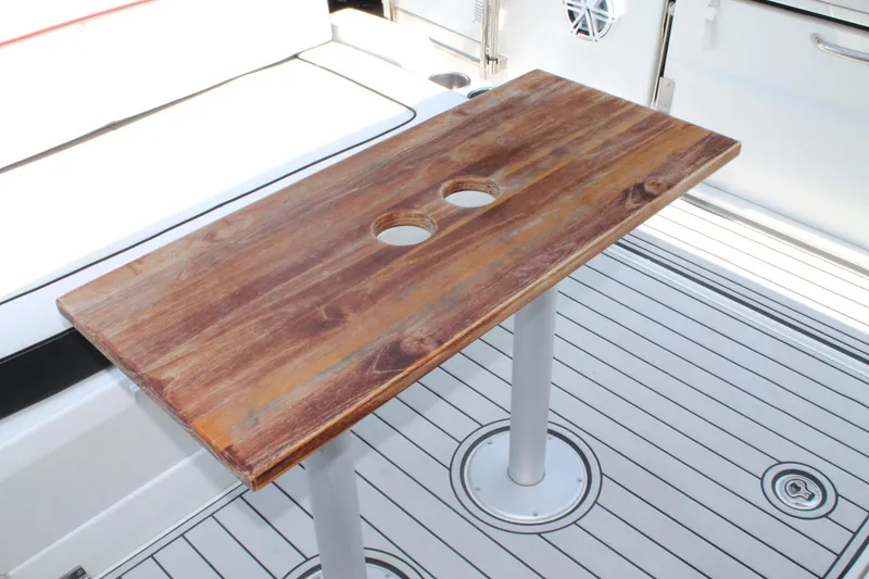 Slide: The Image of Wooden table on Jeanneau Leader 10.5 boat deck, 2021 model, with two cup holders. - 15