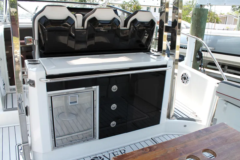 Slide: The Image of 2021 Jeanneau Leader 10.5 boat interior with seating and storage compartments. - 21