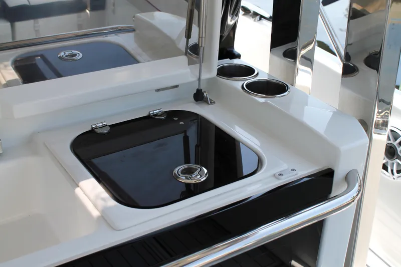Slide: The Image of 2021 Jeanneau Leader 10.5 yacht kitchenette with sleek black and white design. - 23