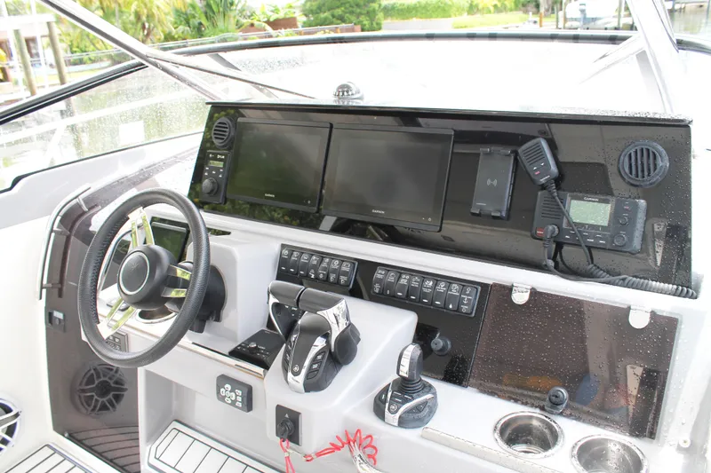 Slide: The Image of 2021 Jeanneau Leader 10.5 WA Series 2 helm with modern navigation equipment and controls. - 34