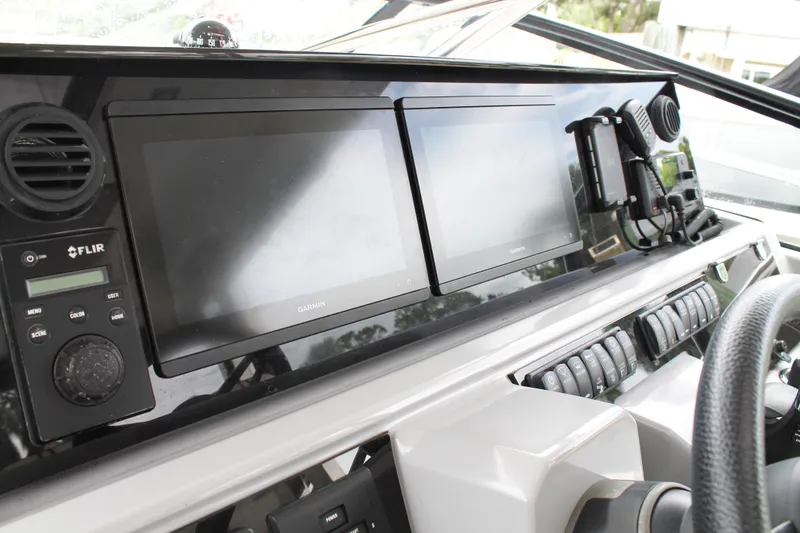 Slide: The Image of 2021 Jeanneau Leader 10.5 WA Series 2 dashboard with Garmin displays and FLIR system. - 35