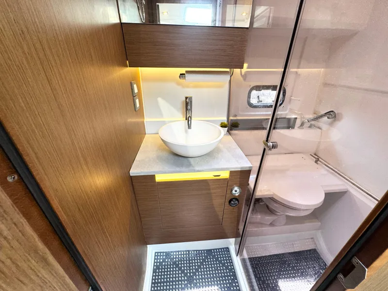 Slide: The Image of Modern bathroom in 2021 Jeanneau Leader 10.5 yacht with sleek sink and compact toilet. - 46
