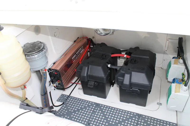 Slide: The Image of 2021 Jeanneau Leader 10.5 engine compartment with batteries and equipment. - 49