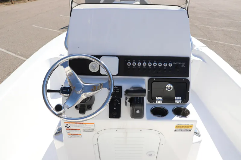 Slide: The Image of 2024 Blazer Bay 2220 Fisherman boat console with steering wheel and control panel. - 10