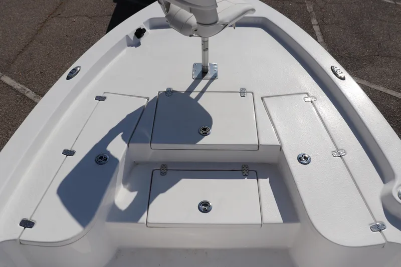 Slide: The Image of 2024 Blazer Bay 2220 Fisherman boat deck with storage compartments and seating. - 2