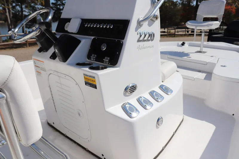 Slide: The Image of 2024 Blazer Bay 2220 Fisherman boat console with steering wheel and controls. - 9
