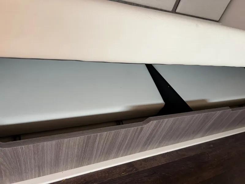 Slide: The Image of Luxurious 2022 Regal 36GC boat interior with white seating and modern design. - 12