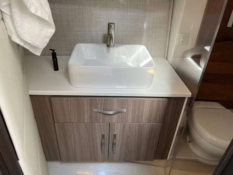 Slide: The Image of Helm of 2022 Regal 36GC boat with modern controls and steering wheel. - 14