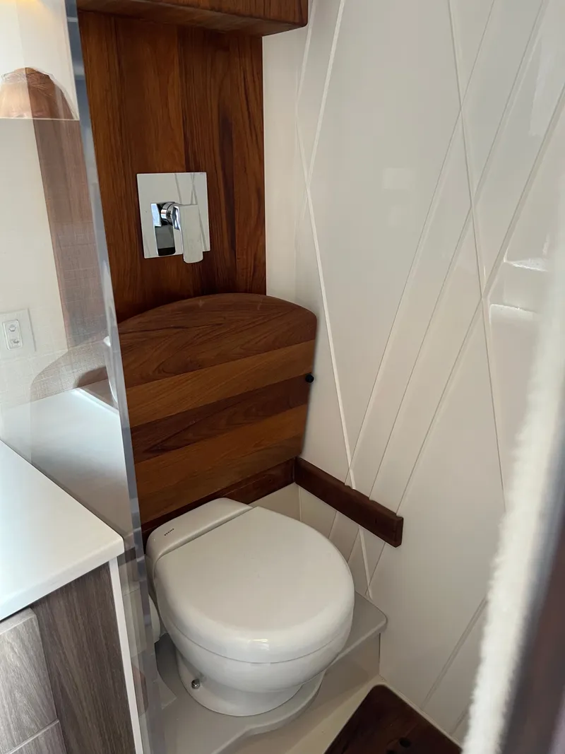 Slide: The Image of Dashboard of a 2022 Regal 36GC boat displaying engine metrics on a Garmin screen. - 16