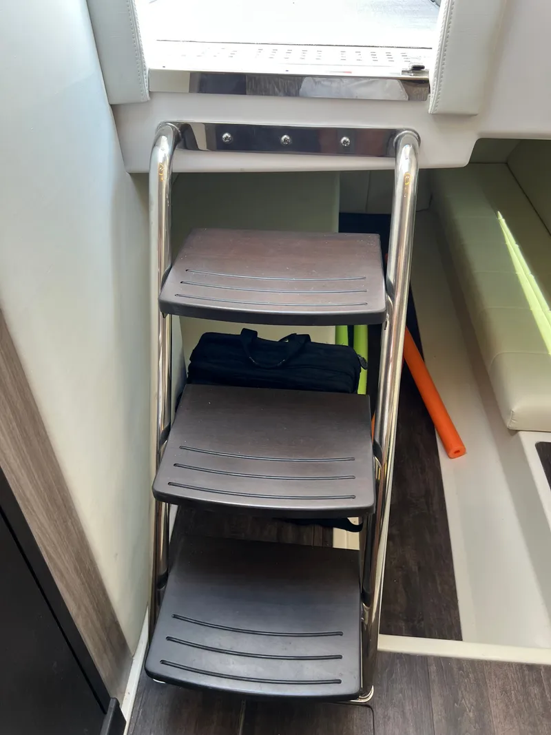 Slide: The Image of Interior of 2022 Regal 36GC yacht with modern seating and sleek cabinetry. - 17