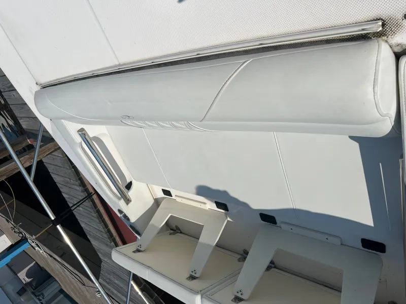 Slide: The Image of Wooden closet with hangers inside a 2022 Regal 36GC boat interior. - 23