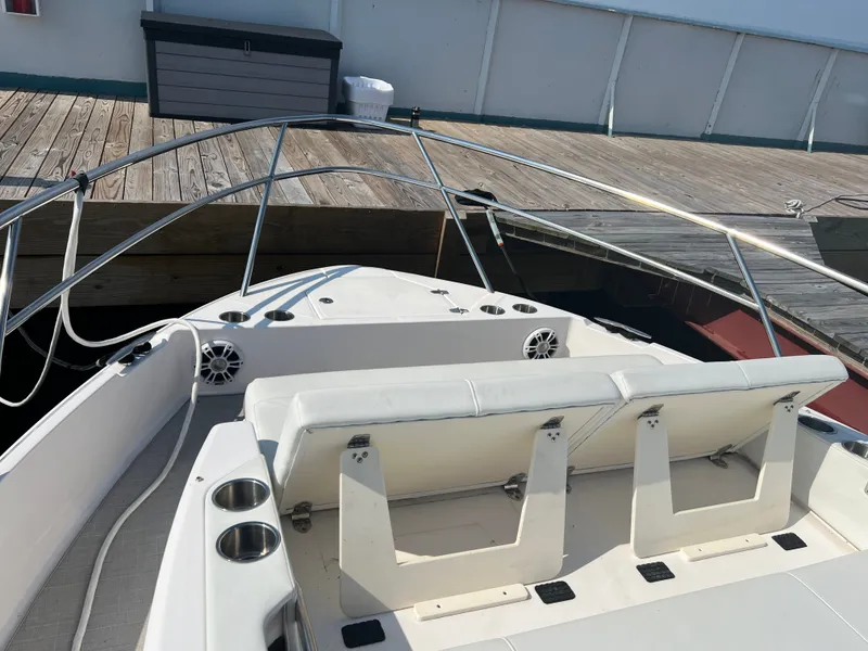 Slide: The Image of Interior of 2022 Regal 36GC yacht with modern seating and compact stairs. - 27