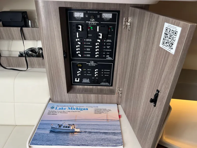 Slide: The Image of 2022 Regal 36GC boat side view against a blue sky background. - 6