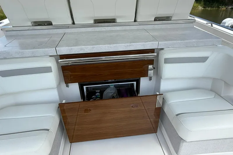 Slide: The Image of 2024 Tiara Yachts 38 LS interior with seating and storage area. - 12