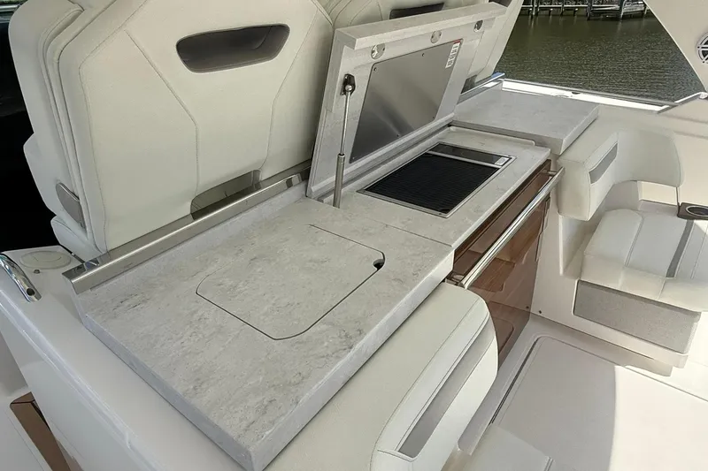 Slide: The Image of 2024 Tiara Yachts 38 LS interior with sleek countertop and integrated grill. - 14