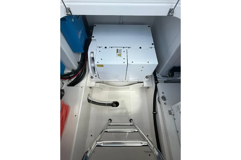 Slide: The Image of Engine compartment of 2024 Tiara Yachts 38 LS, showcasing modern equipment and wiring. - 16