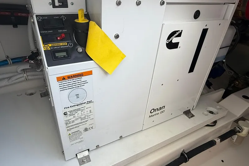 Slide: The Image of 2024 Tiara Yachts 38 LS engine compartment with Cummins Onan Marine QD generator. - 17