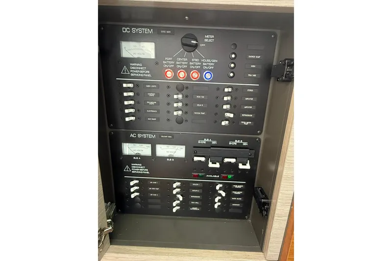 Slide: The Image of Electrical control panel on 2024 Tiara Yachts 38 LS, featuring DC and AC systems. - 22
