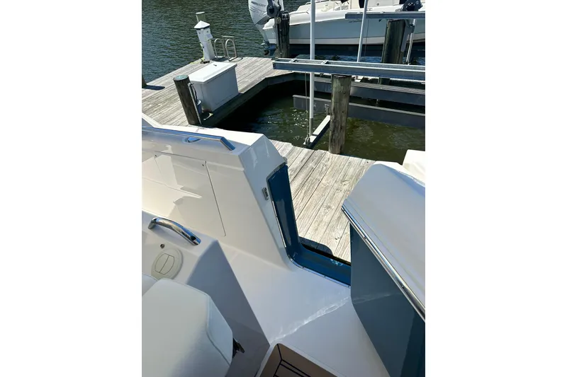 Slide: The Image of 2024 Tiara Yachts 38 LS at dock, showcasing sleek design and modern features. - 25
