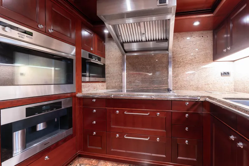 Slide: The Image of Luxurious yacht kitchen with stainless steel appliances and rich wood cabinetry, 2008 Doggersbank Offshore. - 14