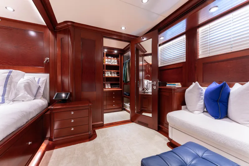 Slide: The Image of Luxurious yacht cabin interior with wooden finishes, plush seating, and elegant bedding, 2008 Doggersbank Offshore. - 21