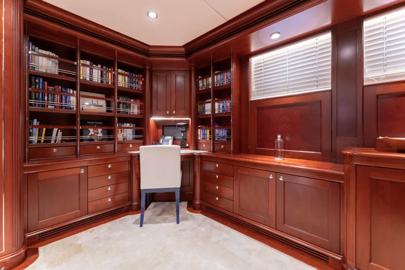 Slide: The Image of Luxurious yacht library with rich wood paneling and built-in bookshelves, Kuipers Woudsend 2008. - 23