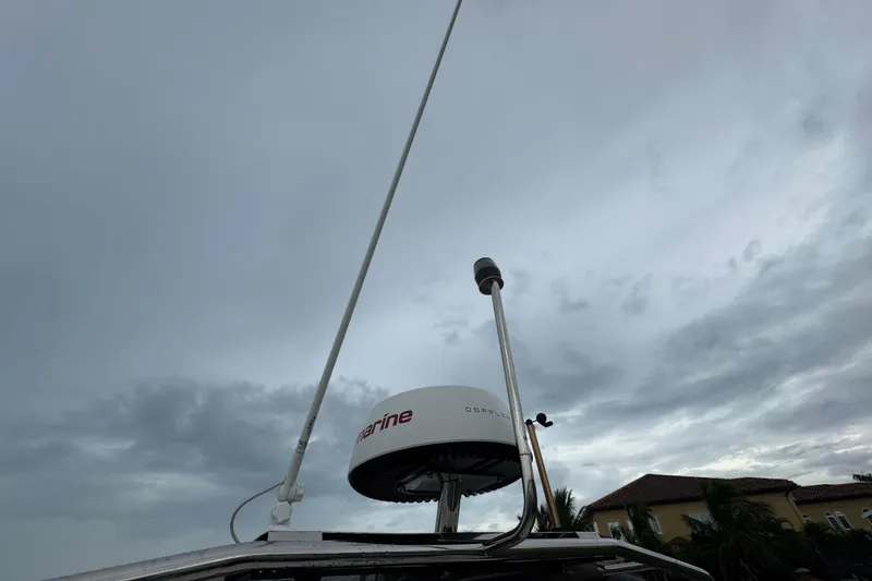 Slide: The Image of Antenna and radar equipment on 2023 Beneteau Swift Trawler 35 under cloudy sky. - 29