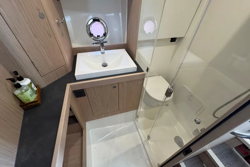 Slide: The Image of Bathroom interior of 2023 Beneteau Swift Trawler 35 with modern sink and shower. - 41