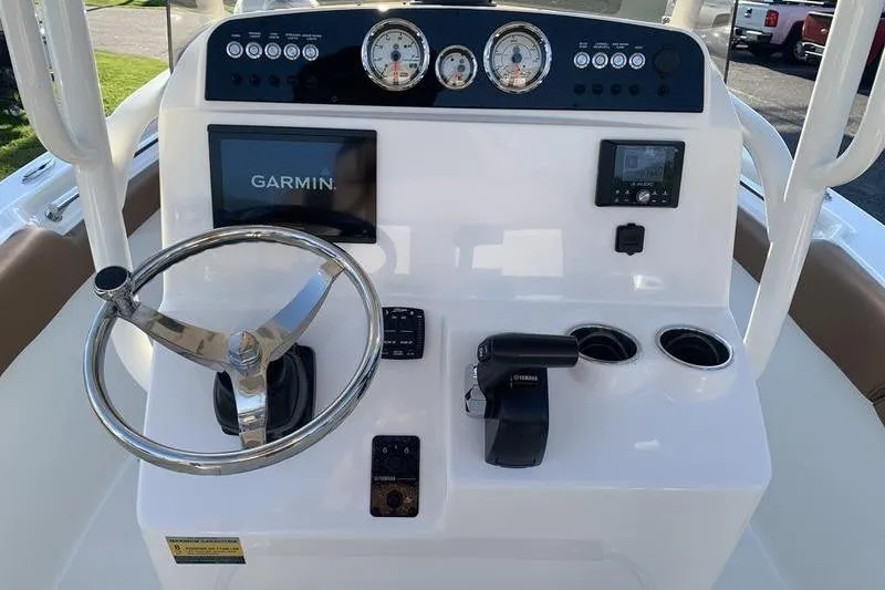 Slide: The Image of 2026 Pioneer ISLANDER 202 boat dashboard with Garmin display and Yamaha controls. - 17