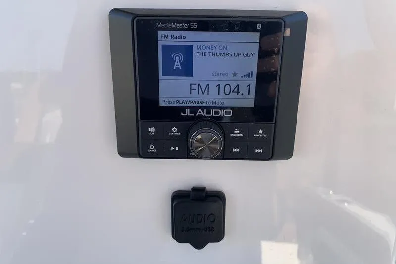 Slide: The Image of JL Audio MediaMaster 55 radio display on Pioneer ISLANDER 202, 2026 model. - 18