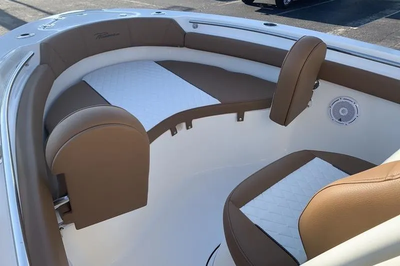 Slide: The Image of 2026 Pioneer ISLANDER 202 boat interior with brown and white cushioned seating. - 25