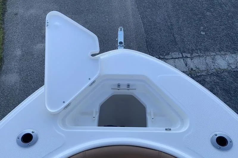 Slide: The Image of Bow storage compartment of 2026 Pioneer ISLANDER 202 boat, open lid, white finish. - 29