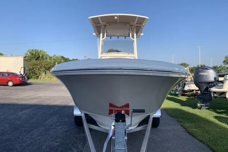 Slide: The Image of 2026 Pioneer ISLANDER 202 boat on trailer, front view, clear sky background. - 7