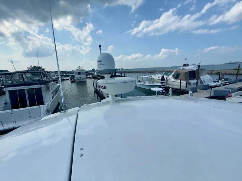 Slide: The Image of 2009 Cruisers Yachts 420 Coupe docked at marina under blue sky. - 19