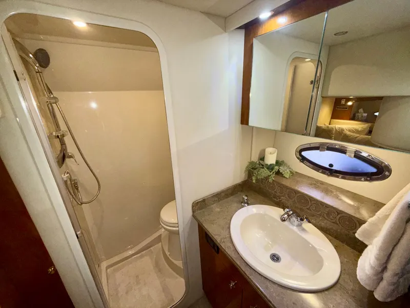 Slide: The Image of Luxurious bathroom in 2009 Cruisers Yachts 420 Coupe with shower and sink. - 22