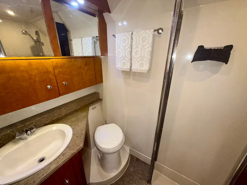 Slide: The Image of Luxurious bathroom in 2009 Cruisers Yachts 420 Coupe with modern fixtures and elegant design. - 37