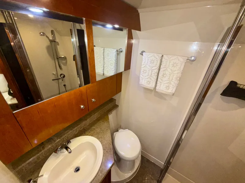 Slide: The Image of Luxurious bathroom in 2009 Cruisers Yachts 420 Coupe with sink, toilet, and shower. - 39