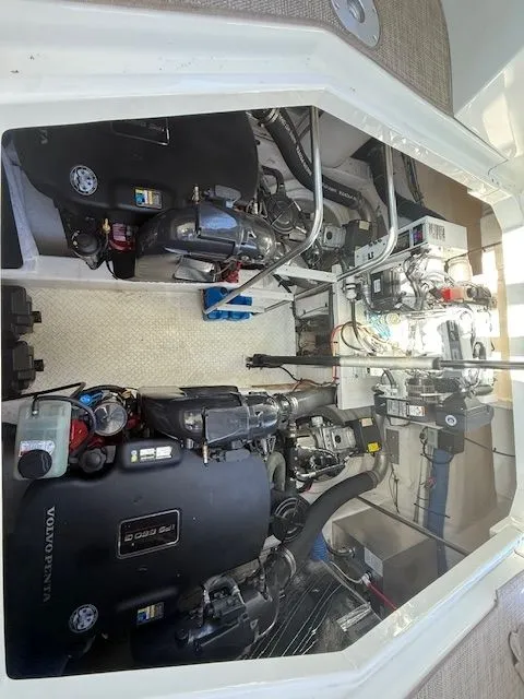 Slide: The Image of Engine compartment of 2009 Cruisers Yachts 420 Coupe, featuring Volvo Penta engines. - 42