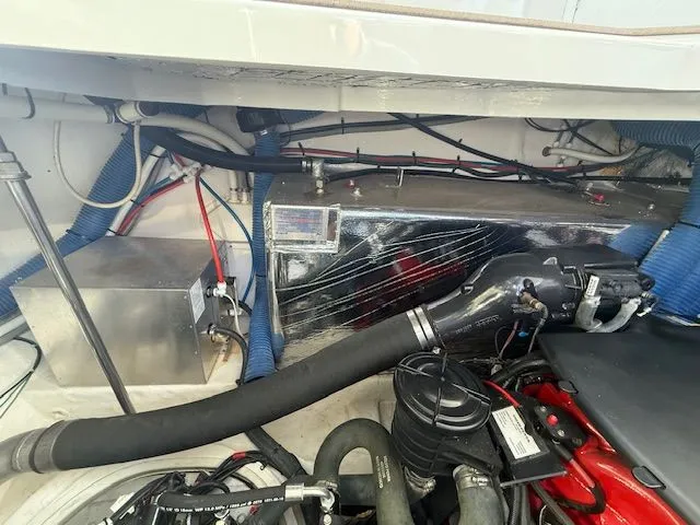 Slide: The Image of Engine compartment of 2009 Cruisers Yachts 420 Coupe with visible components and wiring. - 46