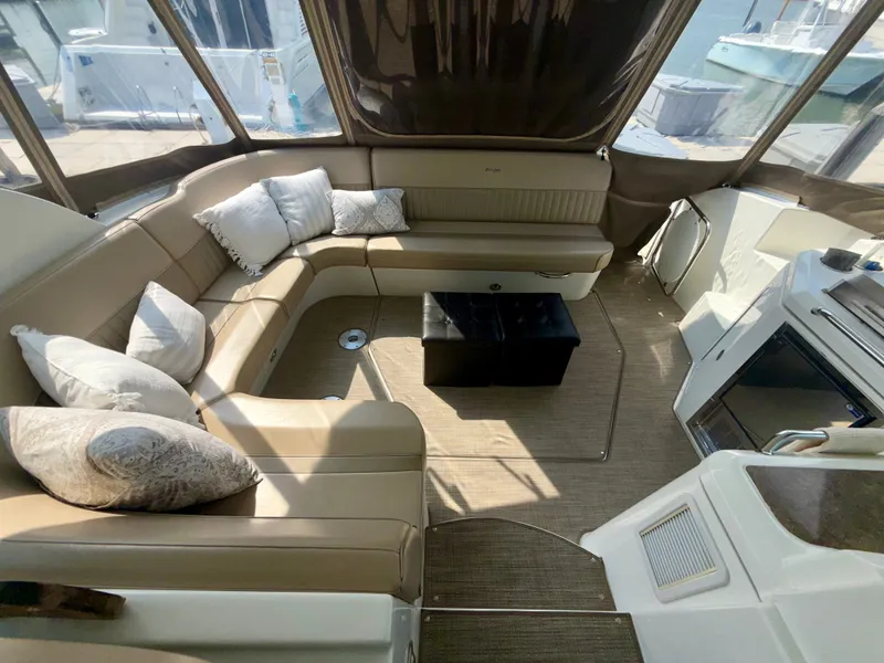 Slide: The Image of Luxurious interior of 2009 Cruisers Yachts 420 Coupe with plush seating and cushions. - 7