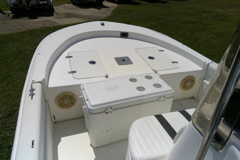 Slide: The Image of 2011 Carolina Skiff JVX18CC boat interior with storage compartments and seating. - 15