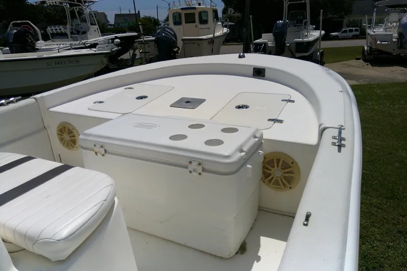 Slide: The Image of 2011 Carolina Skiff JVX18CC boat interior with seating and storage compartments. - 8