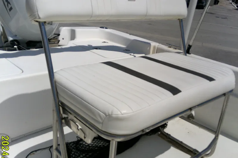 Slide: The Image of White seating on a 2011 Carolina Skiff JVX18CC boat, featuring stainless steel frame. - 9